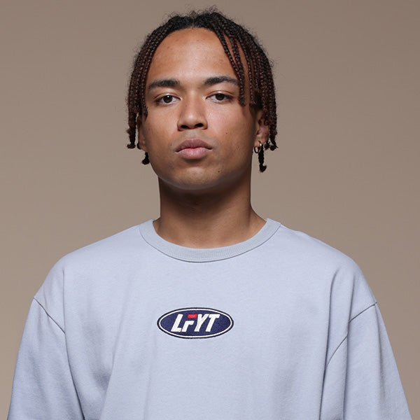 FILA × LFYT Oval Logo Tee