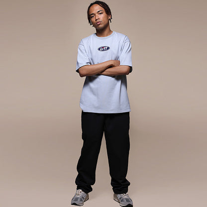 FILA × LFYT Oval Logo Tee